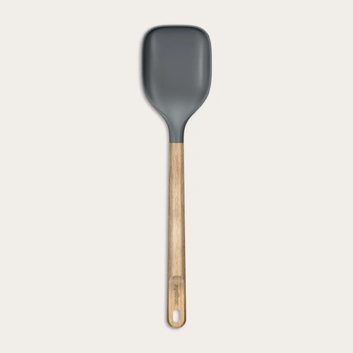 A pair of Zyliss All Purpose Shears with ergonomic handles, cooked chicken leg quarters, lemon slices, garlic cloves, sage leaves, and herbs rest on